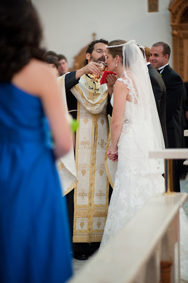 the bride and groom during ceremony rituals - photo by Houston based wedding photographer Adam Nyholt